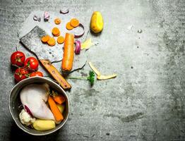 Cutting vegetables for chicken soup. photo