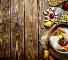 Ingredients for cooking chicken soup with vegetables and spices. photo