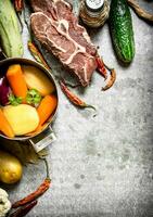 Ingredients for soup with vegetables, spices and meat. photo