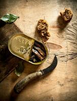Smoked sprats with rye bread. photo