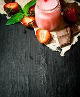 Strawberry smoothie with chocolate and mint. photo
