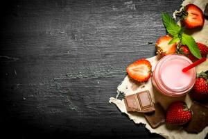 Strawberry smoothie with chocolate and mint. photo