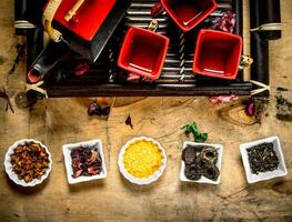 Different types of dried tea in the cups . photo