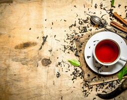 Tea with leaves and cinnamon. photo