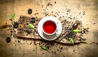 Tea with leaves and cinnamon. photo