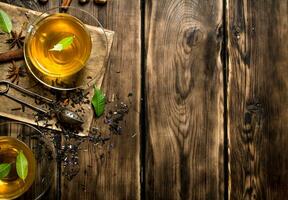 fragrant tea with infuser spoon. photo