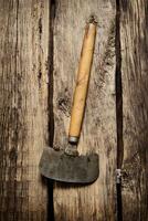 Old carving knife . On wooden background. photo