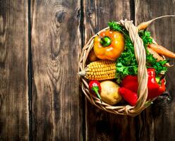 Organic food . Fresh vegetables in the old basket. photo