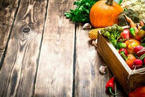 Healthy food. Organic vegetables in an old box. photo