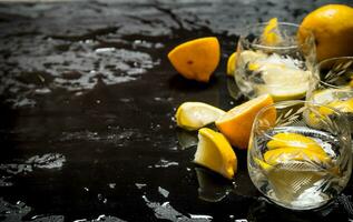 Glasses with vodka and lemon. photo