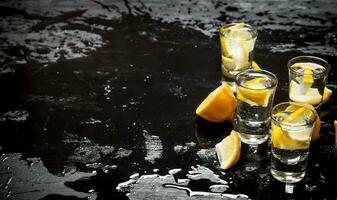 Glasses with vodka and lemon. photo