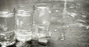 The vodka glass with ice. photo