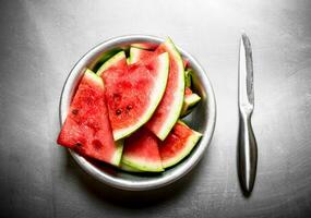 Chopped watermelon in a bowl. photo