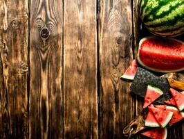 Sliced watermelon with an axe. photo