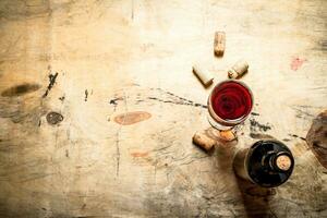 Red wine with corks. photo