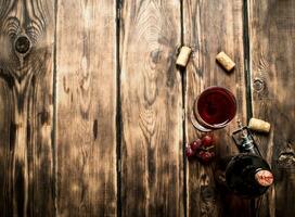 Red wine with corks. photo