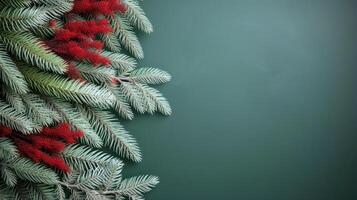 Minimalist Christmas background. Fir tree branches decoration flat lay. Spruce twigs laid out on green backdrop with copy space for text photo