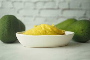 avocado and avocado pasted in a container photo