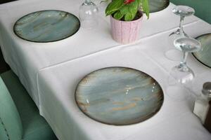 Empty blank ceramic dish on table photo