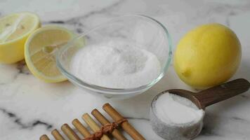 Baking soda and whole lemon on table video