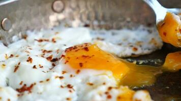 Fried eggs in the plate close up , video