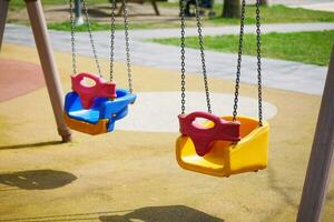 Close-up of a baby swing in the playground photo