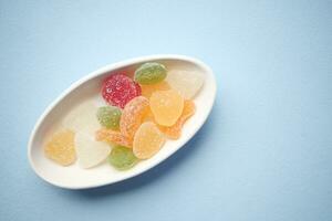 colorful candy sweet jelly in a bowl on table photo