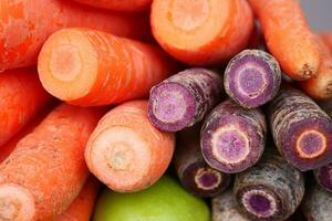 pile carrot displaying at local shop. photo