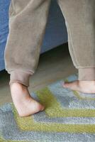low angle view of A child walking on tiptoes photo