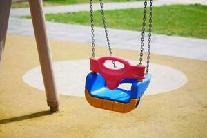 Close-up of a baby swing in the playground photo