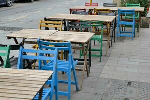 cafe interior design. Colorful blue and pink chairs and tables. photo