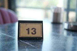 14 number sign number on cafe table . photo