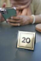 20 number sign number on cafe table . photo