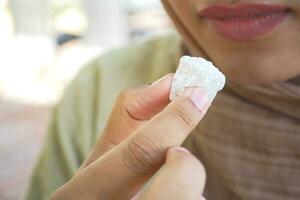 women eating turkish delight or lokum photo