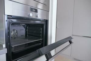 open electric oven at home photo