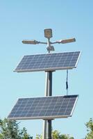 solar panel with a battery against blue sky photo