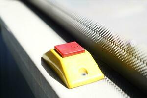 Closeup of Bus bell switch for stop inside the public bus photo