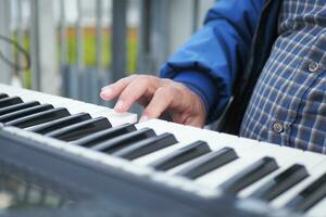 person hands playing grand piano photo