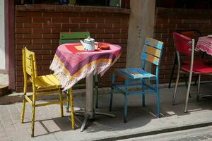 cafe interior design. Colorful blue and pink chairs and tables. photo