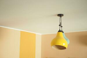 colorful ceiling lamp hanging in a room , photo