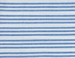 Texture of linen white towel with blue stripes photo