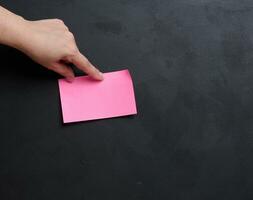 Representing the concept of searching for solutions and answers to questions, hand hold paper sticker photo