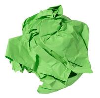 Green crumpled ball of paper on a white isolated background photo