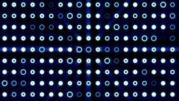 Abstract background of bright blue glowing light bulbs from circles and dots of energy magic disco wall video