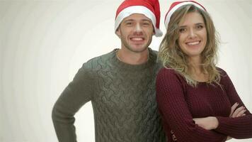 Cheerful couple in Santa hat laughs video