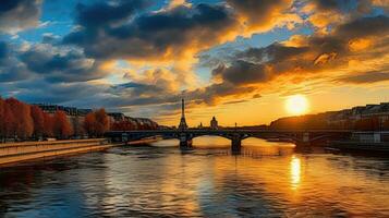 This captivating image features a breathtaking sunset casting a warm, golden glow over the Seine River in Paris. The sky is adorned with vibrant hues of orange and red, creating a picturesque scene photo
