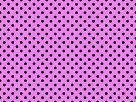black polka dots over violet background photo