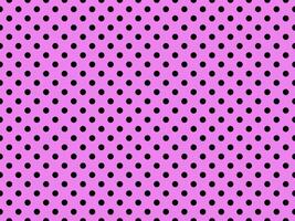 black polka dots over violet background photo