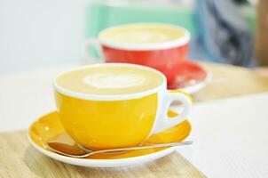 cup of coffee on table in coffee shop photo