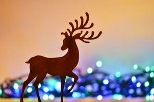Navidad antecedentes con ciervo silueta. foto